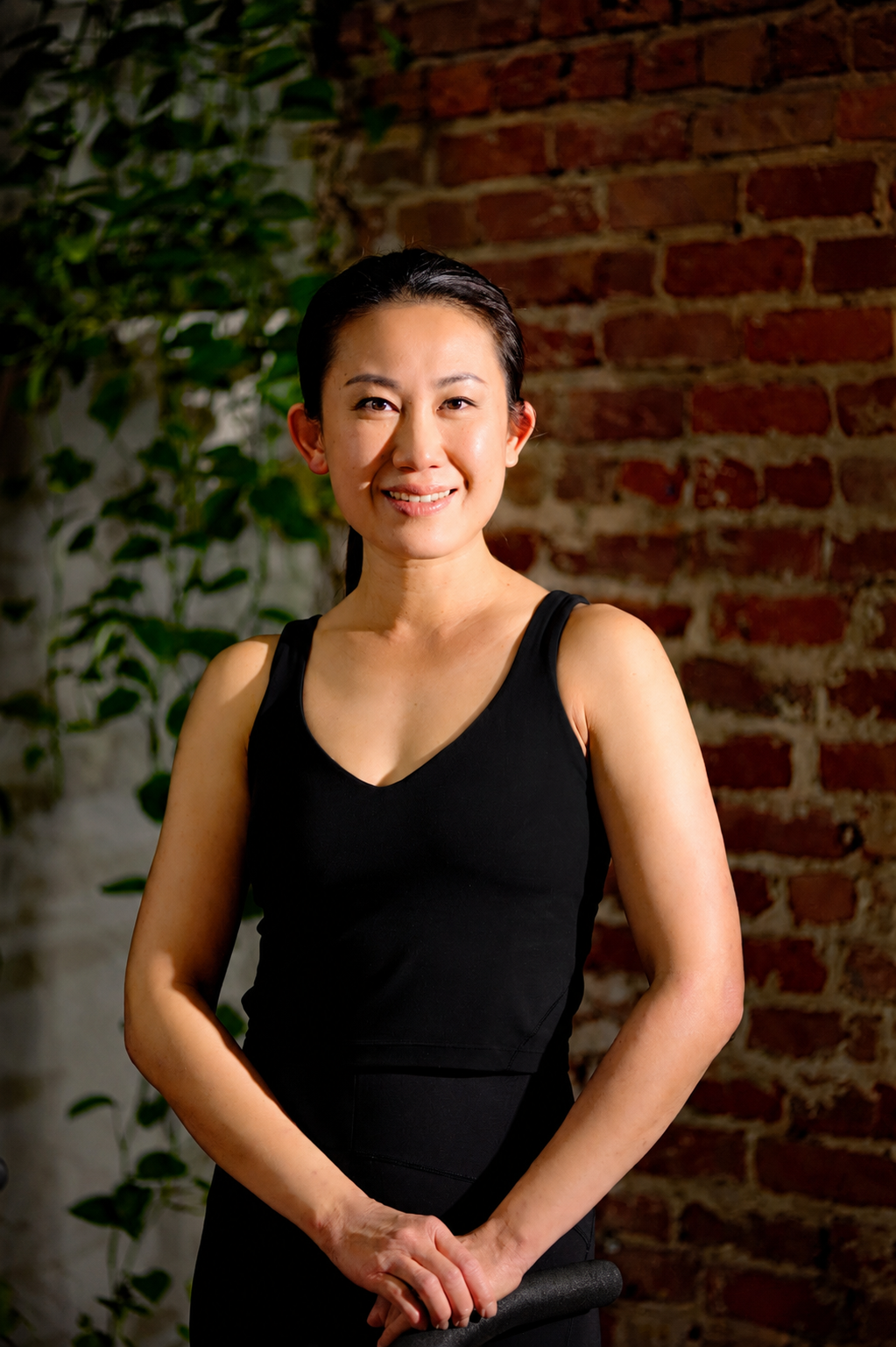 Portrait of Mabel Ng Lau in a sunlit studio